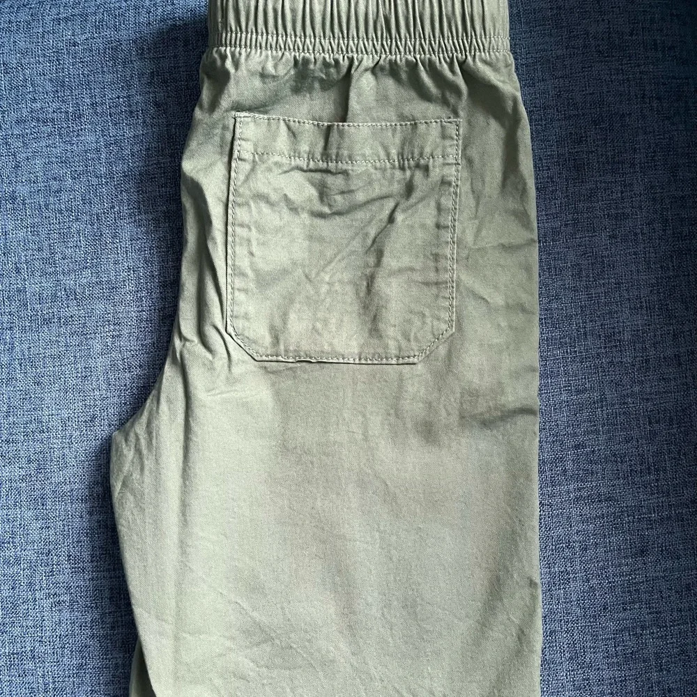 Lot of Old Navy shorts, Light blue, light green, light tan, navy with sharks 8